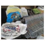 Hand woven floor rug and bed linens...