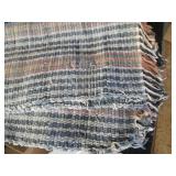 Hand woven floor rug and bed linens...