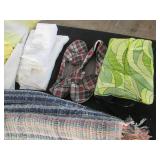 Hand woven floor rug and bed linens...