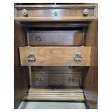 Antique Wooden Armoire with Brass Accents and Drawers