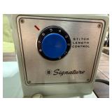 Vintage Signature Sewing Machine with Integrated Wood Cabinet