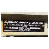 Vintage Signature Sewing Machine with Integrated Wood Cabinet