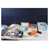 Assorted Office Supplies Including Envelopes, File Folders, and More