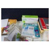 Assorted Office Supplies Including Envelopes, File Folders, and More