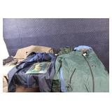 Assorted Outdoor Gear with Jackets, Gloves, and Accessories