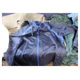 Assorted Outdoor Gear with Jackets, Gloves, and Accessories