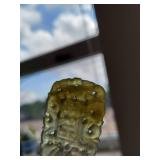 Elegant Hand-Carved Jade Pendant