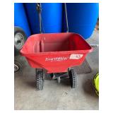 Earthway spreader and garden hose