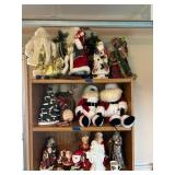 Collection of Santa Claus Figurines and Christmas Decorations
