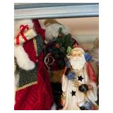 Collection of Santa Claus Figurines and Christmas Decorations
