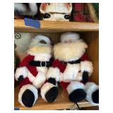 Collection of Santa Claus Figurines and Christmas Decorations