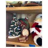 Collection of Santa Claus Figurines and Christmas Decorations