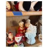 Collection of Santa Claus Figurines and Christmas Decorations