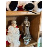 Collection of Santa Claus Figurines and Christmas Decorations