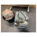 Bin of rugs, pillows, bedsheets
