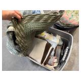 Bin of rugs, pillows, bedsheets