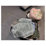 Bin of rugs, pillows, bedsheets