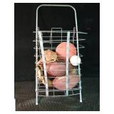 Cart full baseball gloves, baseballs and footballs
