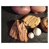 Cart full baseball gloves, baseballs and footballs