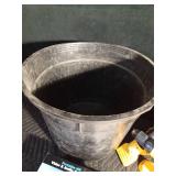 Tub of auto accessories, new tiedowns, chainsaw chain guard, Dewalt battery operated tools, and 2 gas cans