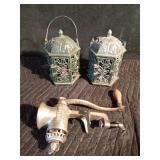 Cast iron candle lanterns and a meat grinder