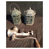 Cast iron candle lanterns and a meat grinder