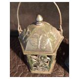 Cast iron candle lanterns and a meat grinder