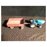 Metal toy tractor with an Ertyl trailer