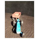 Metal toy tractor with an Ertyl trailer
