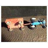 Metal toy tractor with an Ertyl trailer