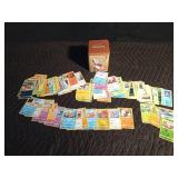 Pokémon tin filled with 100 Pokémon trading cards