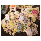 Pokémon tin of 100 Pokémon trading cards