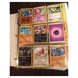 90 Pokémon cards in a binder