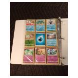 90 Pokémon cards in a binder