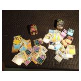 2 Pokemon tins of 50 pokemon trading cards each