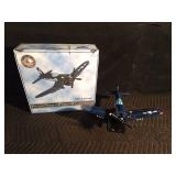 Replica of a fire bomber F4U-4 Corsair plane on stand and in original box