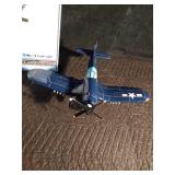 Replica of a fire bomber F4U-4 Corsair plane on stand and in original box