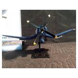 Replica of a fire bomber F4U-4 Corsair plane on stand and in original box