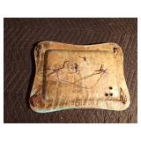 Replica of a WW1 German Mauser on a brass tray of German stamps