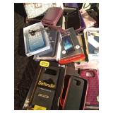 Lot of phone cases including an Otter and tablet covers