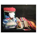Laundry basket of kitchen towels and dish cloths, wash cloths, rugs, table cloth and runner and floor scrubber pads, bathmat