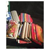 Laundry basket of kitchen towels and dish cloths, wash cloths, rugs, table cloth and runner and floor scrubber pads, bathmat