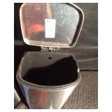 2 flip-top garbage cans