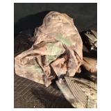 12 plastic duck decoys and blind netting