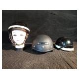 2 Vintage fire fighter helmets and a Raider helmet