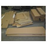 Stack of misc unassembled cardboard...