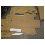 Stack of misc unassembled cardboard...