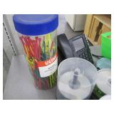 Contents of shelf filled with office supplies