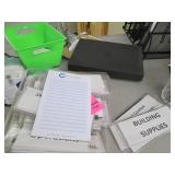 Contents of shelf filled with office supplies