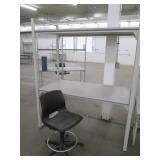 Industrial desk or shelf with a rolling office chair